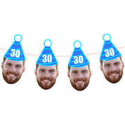 Four blue party hats with '30' on a white background, featuring cutouts of a man's face.