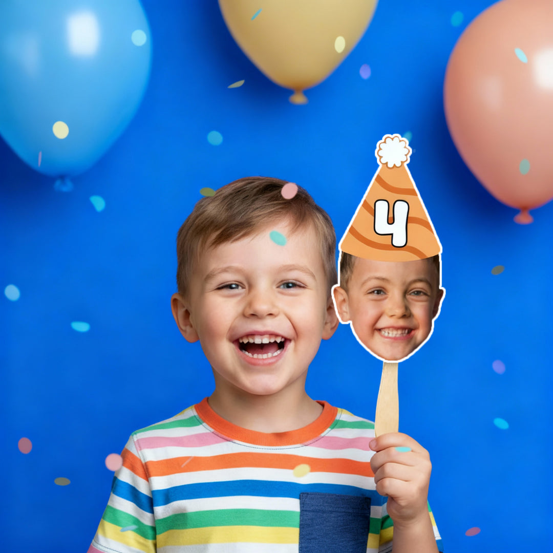 Child holding a birthday hat cutout with number 4 against a blue background with balloons
