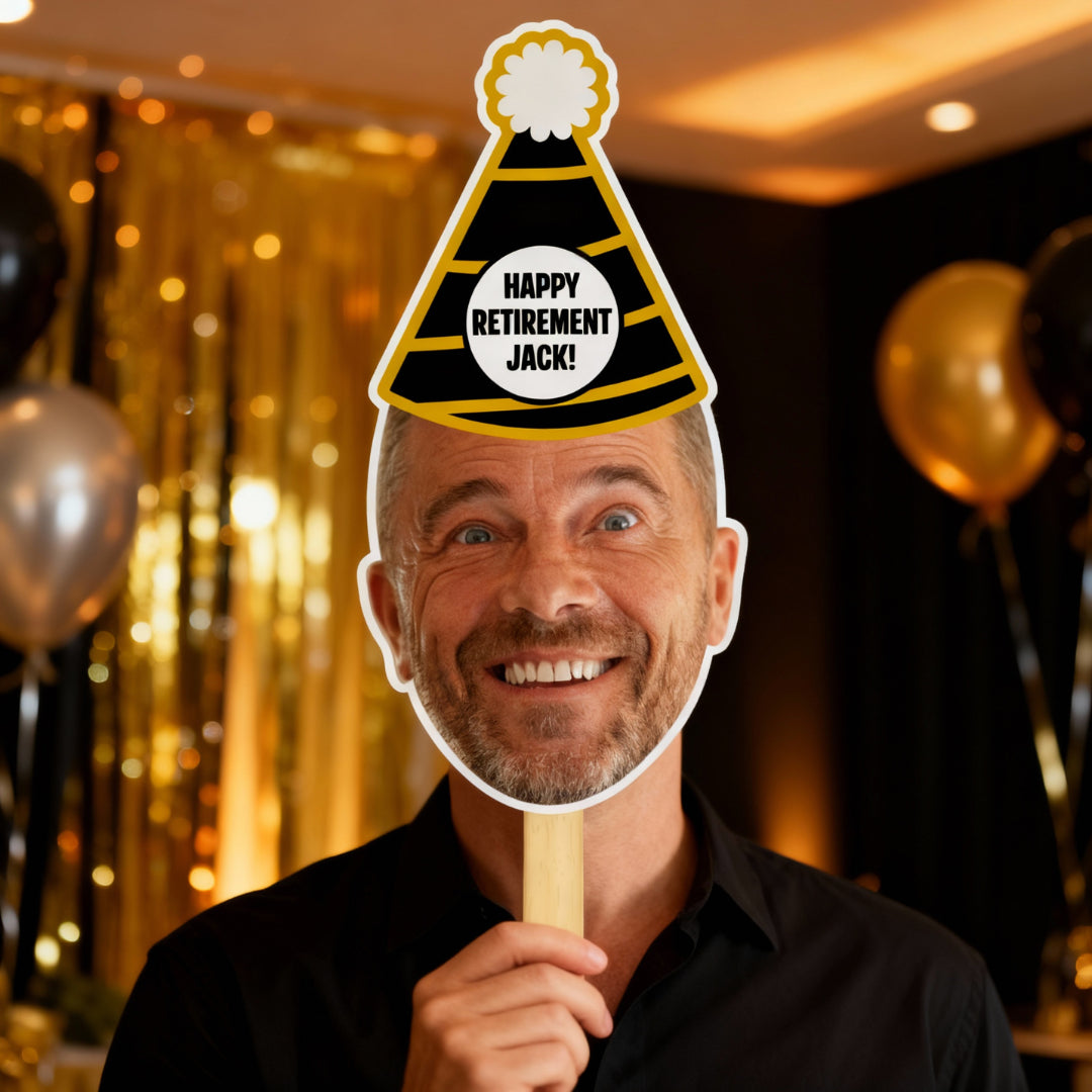 Man holding a 'Happy Retirement Jack!' cutout with a festive background